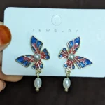 Butterfly pearl drop earring